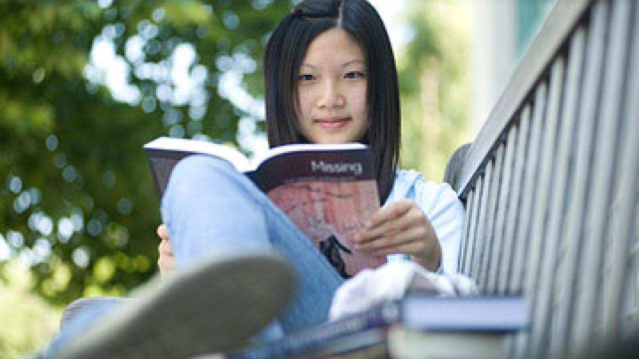 Photo: woman reading book