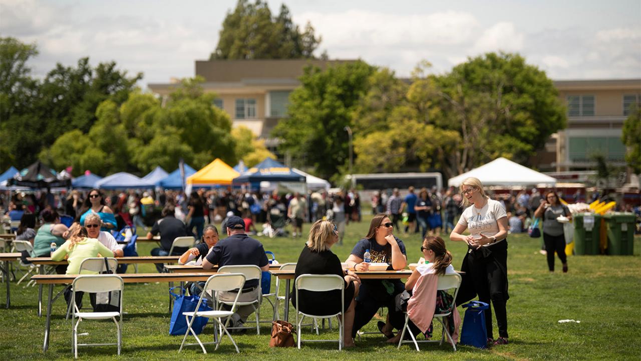 Staff eat at the Thank Goodness for Staff picnic.