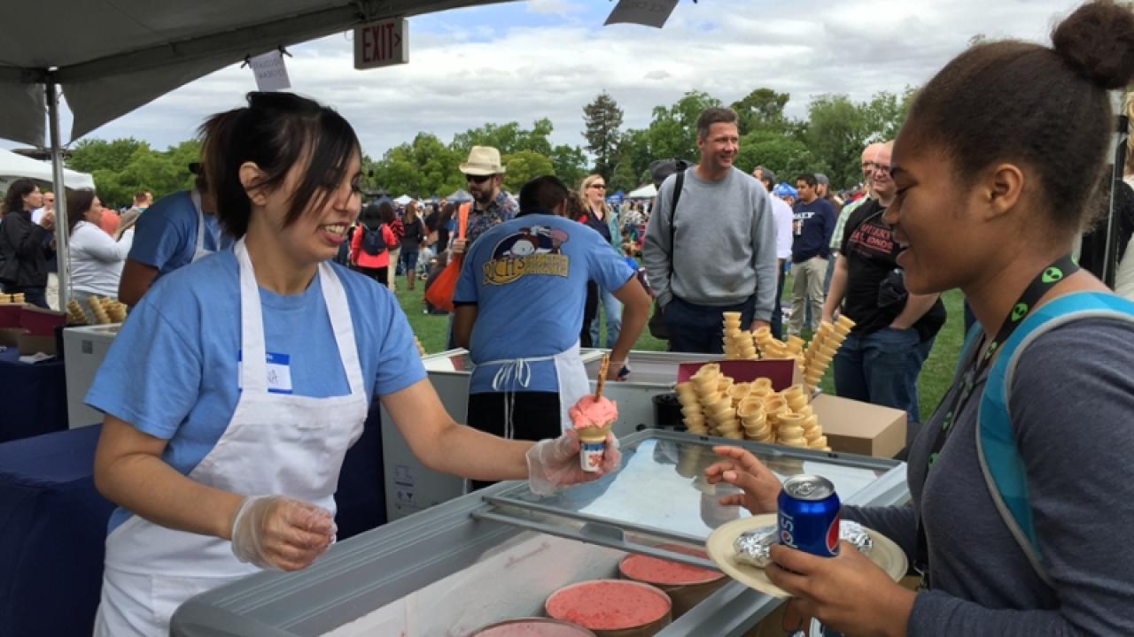 A UC Davis staffer gets an ice cream cone at the Thank Goodness for Staff picnic event.