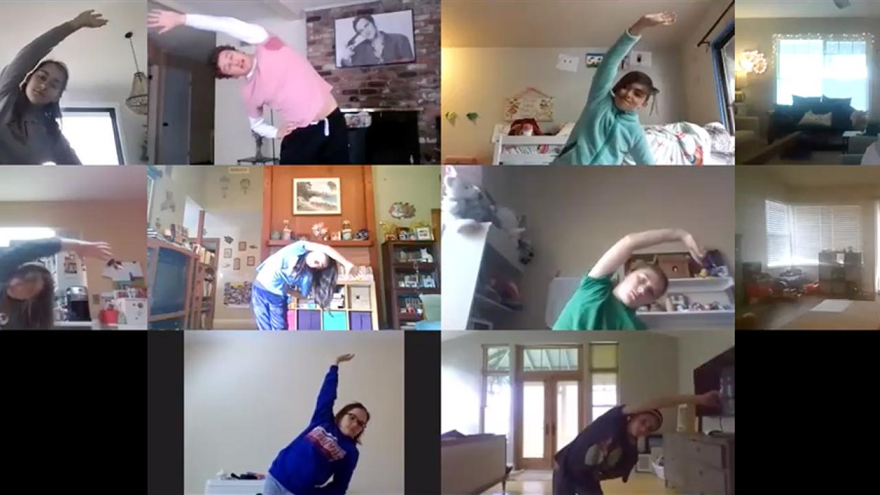 Screenshot of video conference call showing children stretching.