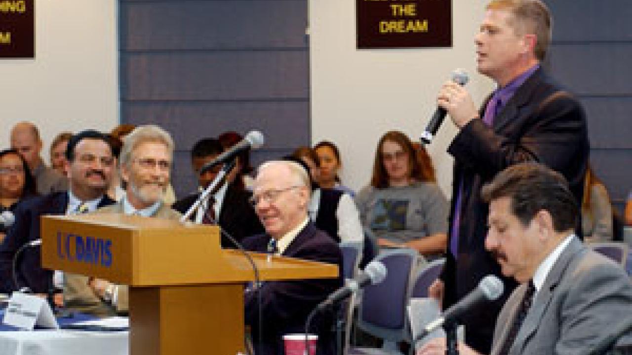 Ed Emerson, of the Democratic caucus, addresses budget cuts at the town hall, as Cosumnes River College President Francisco Rodriguez,  industry leader Tim Mondavi, Chancellor Larry Vanderhoef and CSUS President Alexander Gonzalez listen.