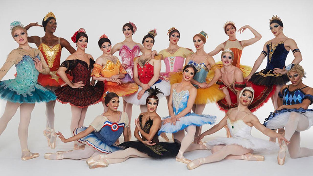 Photo: Cast of Les Ballets Trockadero, in colorful ballet costumes.