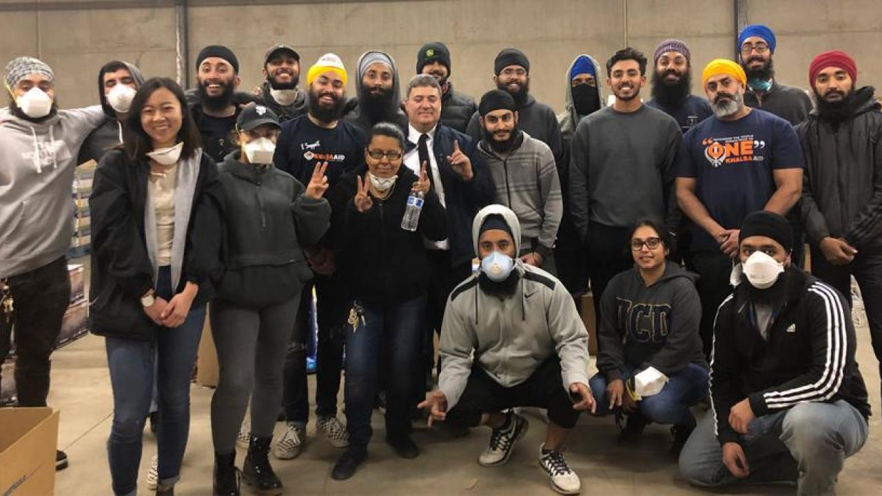Students and alumni pose for group photo after delivering relief supplies to Chico warehouse.