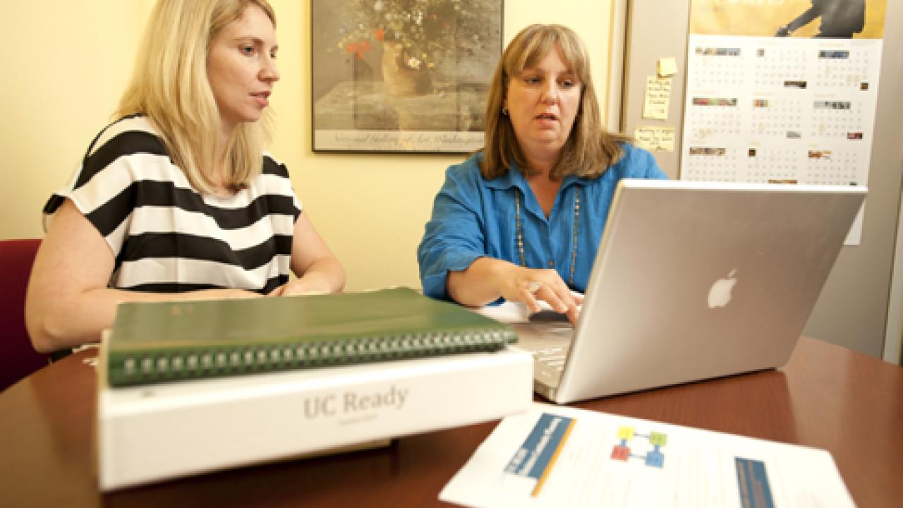 Photo: Andrea Tsatoke, left, mission continuity planner, and Joan Zimmermann, director of administration in the School of Education
