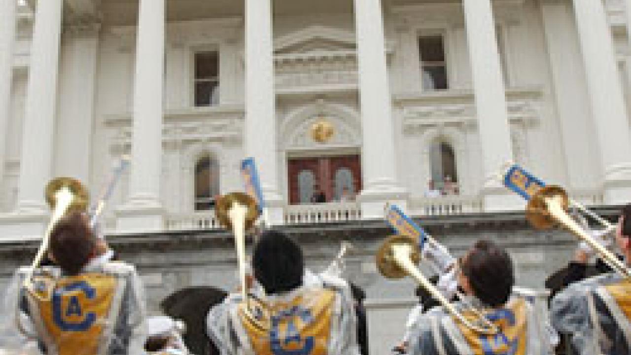 From the top, Robert Kerr of UC Davis, right, meets with State Sen. Mike Machado, D-Linden; the Aggie Band-Uh! serenades the State Capitol; and Assembly Speaker Fabian N&Atilde;&ordm;&Atilde;&plusmn;ez, D-Los Angeles, receives Legislator of the Year recognition.