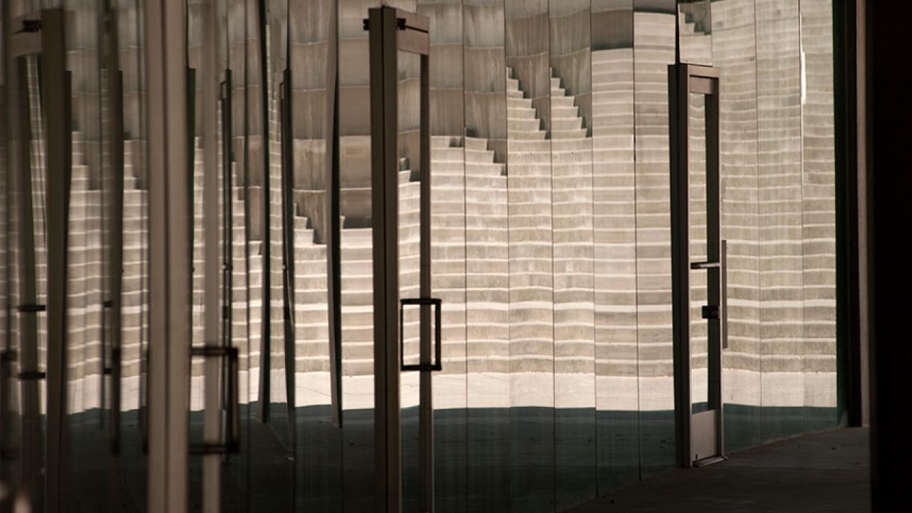Reflections in a glass wall of the Social Sciences and Humanities Building