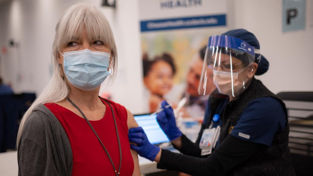 Woman receives vaccination.
