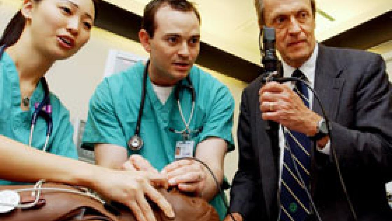 UC President Robert Dynes spent May 27-28 taking part in various activities -- including a jog and ice cream social for students question-and-answer session at Mondavi Center -- and visiting dozens of academic and research units. Here, he assist