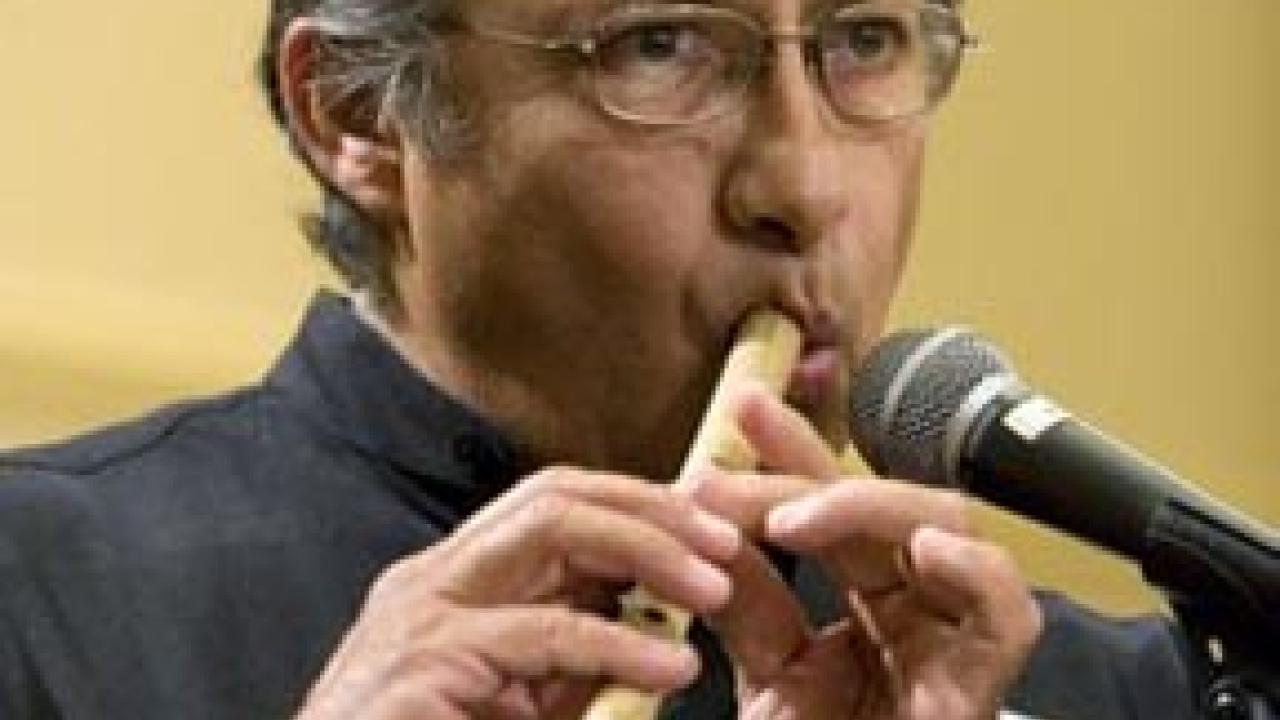 Antonio Flores plays a flute made from elderberry wood.