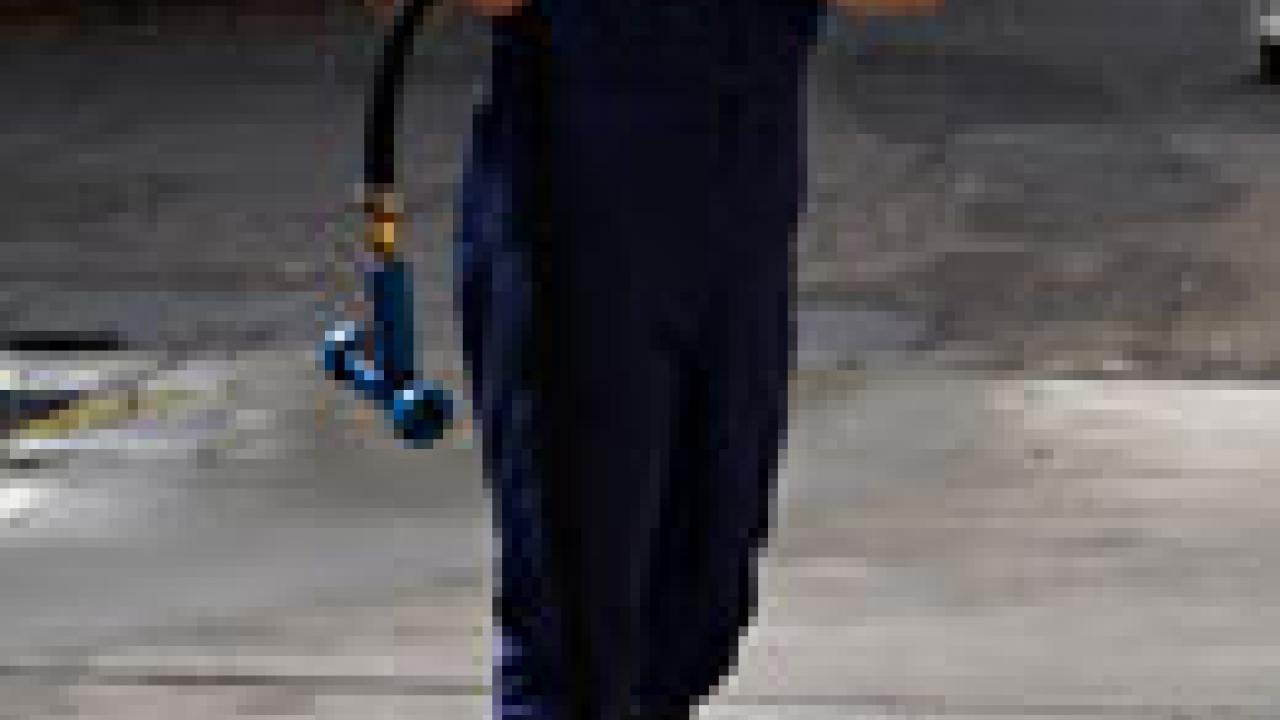 Chik Brennaman works with students during a winemaking class in the Pilot Winery near Wickson Hall. Students are the best part of his job, he said. &ldquo;I see myself 10 years ago.&rdquo;