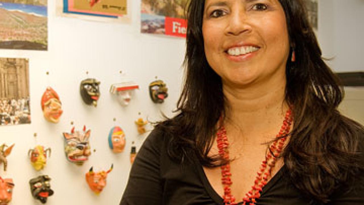 Photo: Zoila Mendoza standing in her decorated office