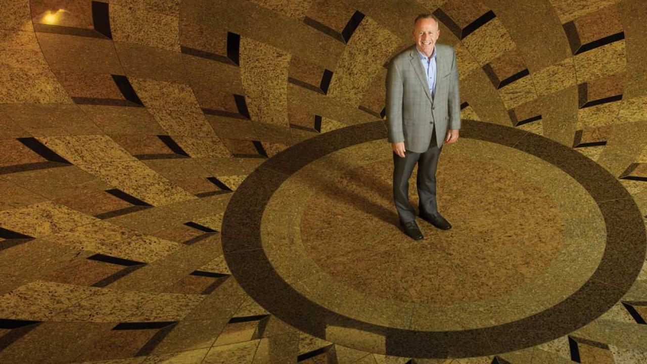 Darrell Steinberg stands on the floor of city hall