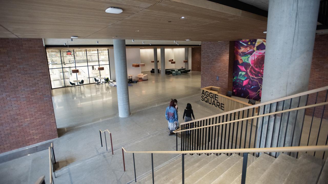 3 students at the botton of a staircase at Aggie Square