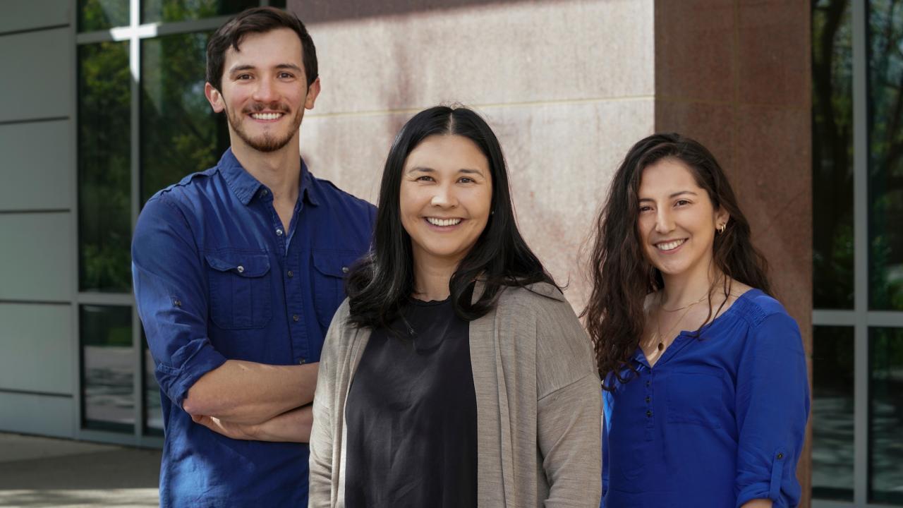 Group of three facing camera