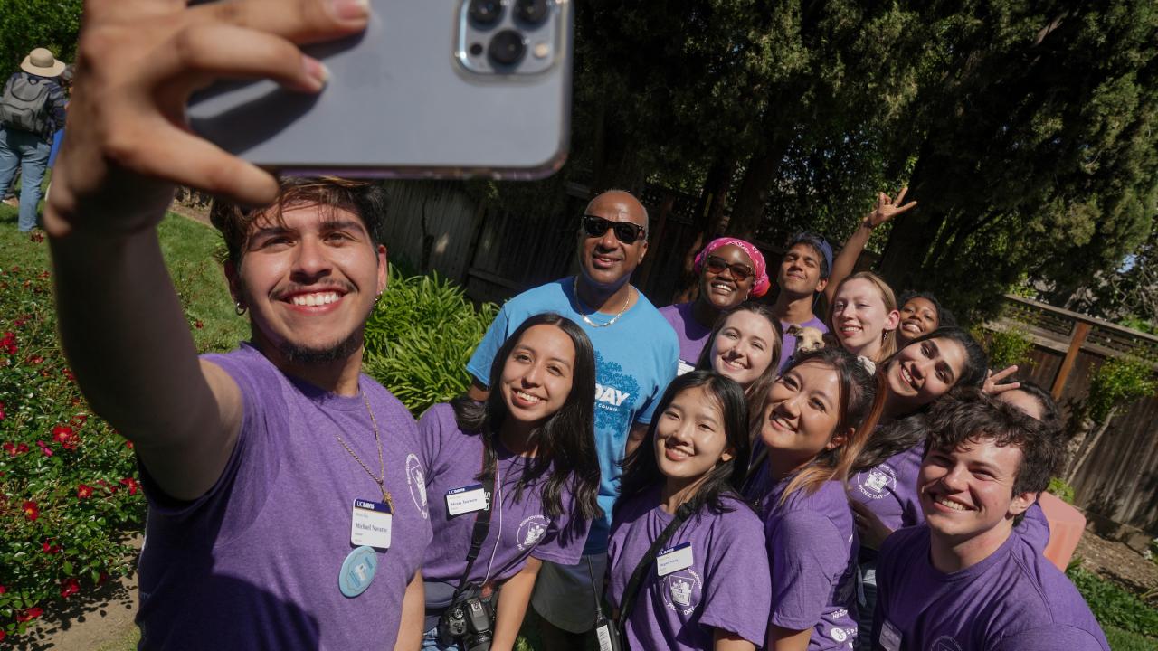 Chancellor May poses with the students on the Picnic Day committee during the icecream social at the Chancellor's Residence.