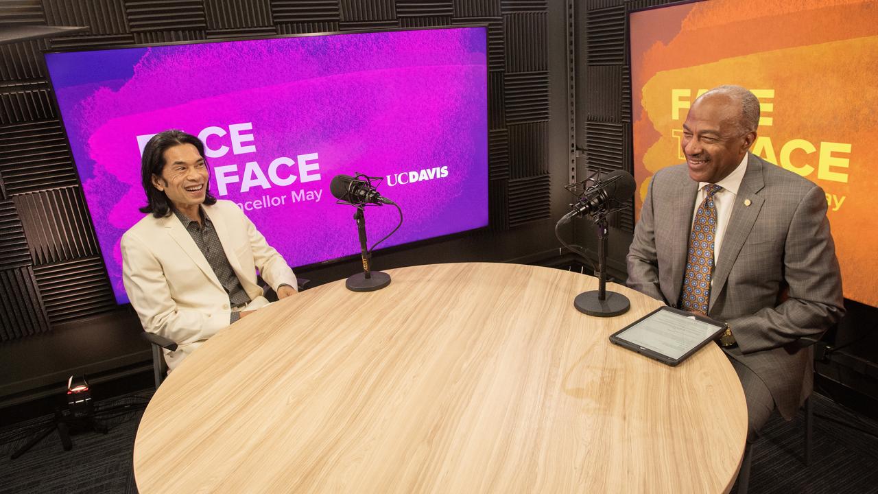 Mikael Villalobos and Chancellor Gary May in a podcast studio