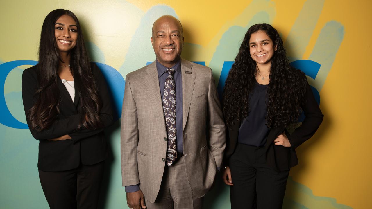 Chancellor Gary May with Jaya Athuluru and  Simrain Lallian