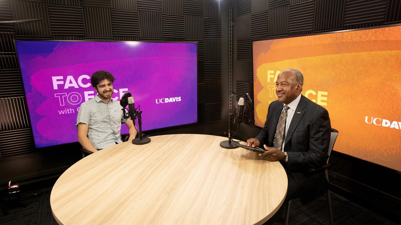 Miguel Craven sitting next to Chancellor May