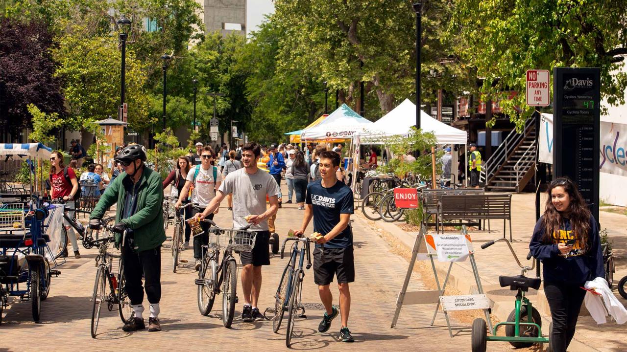 People walk on Third Street in Davis