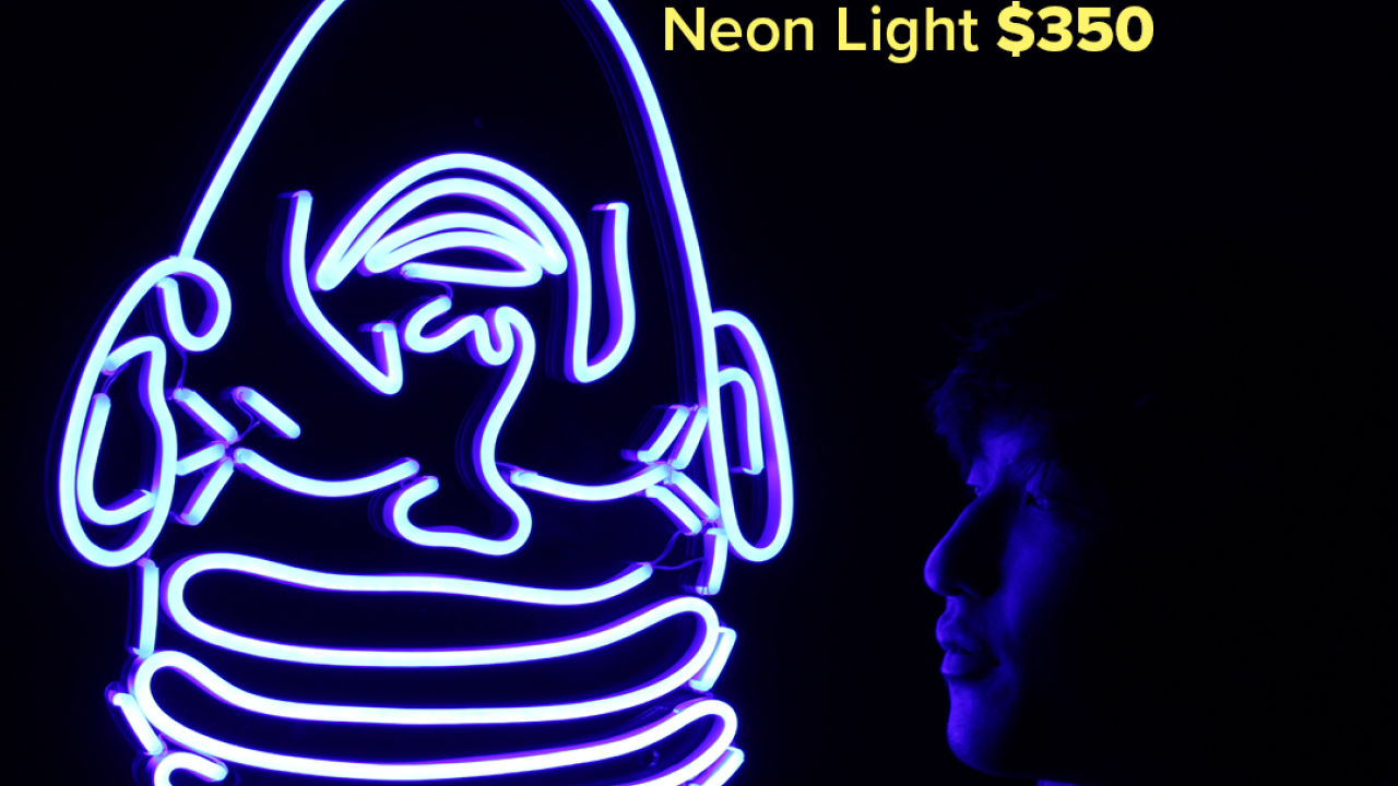 Ad creative for Neon Light from the Arneson Eggheads Collection featuring the headline "Light up your creativity"