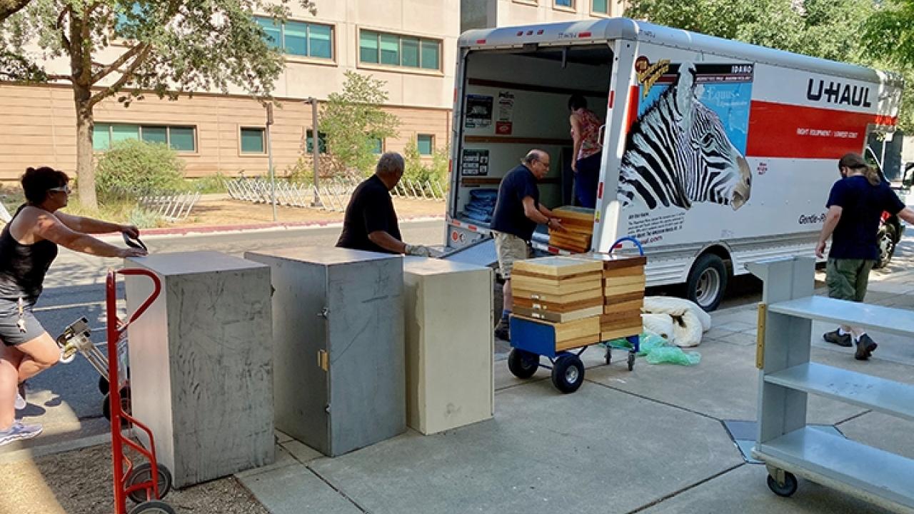 Boxes being unloaded from a U-haul van 