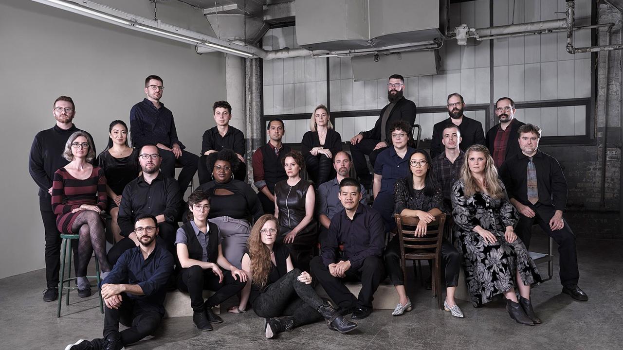 Photo of group of people dressed in black.