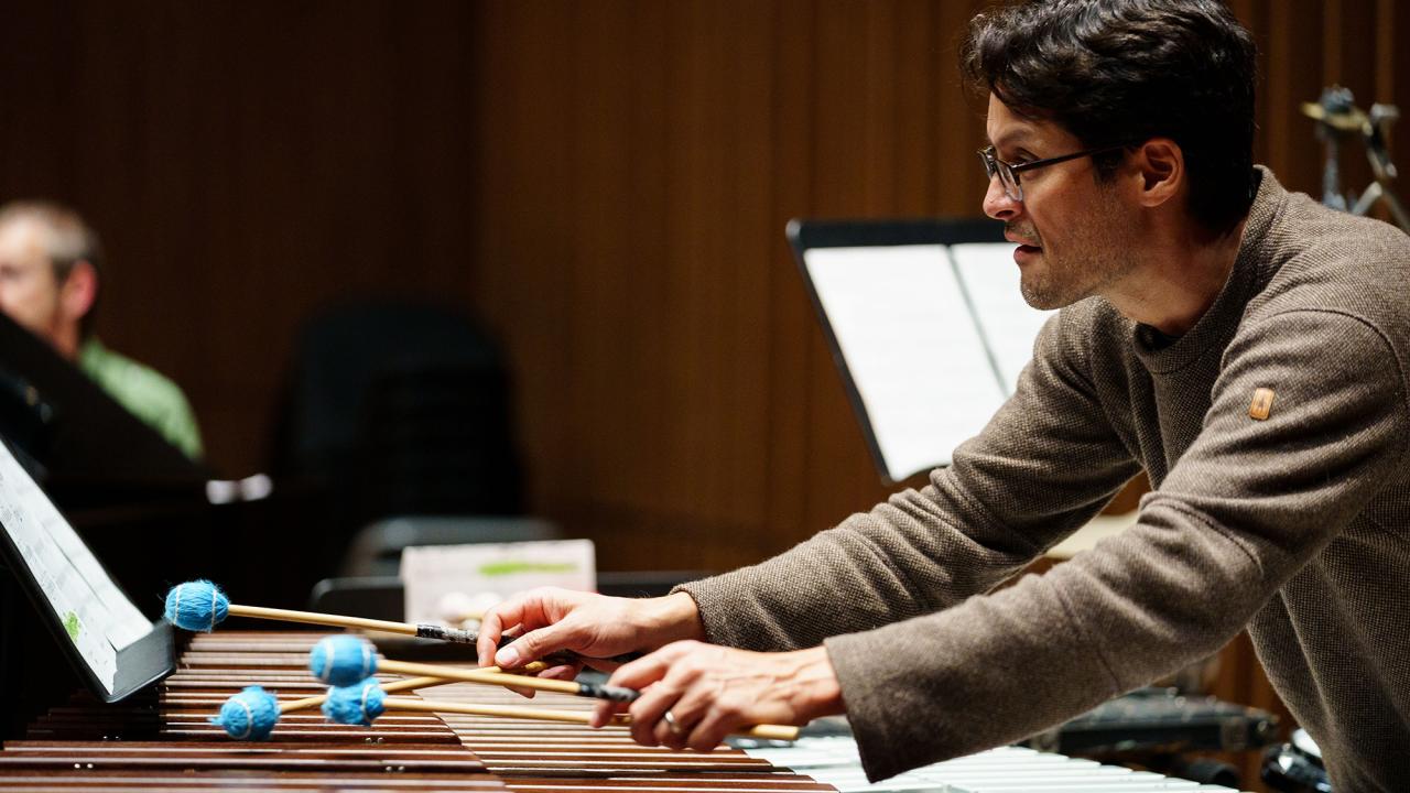 A man plays a percussive instrument
