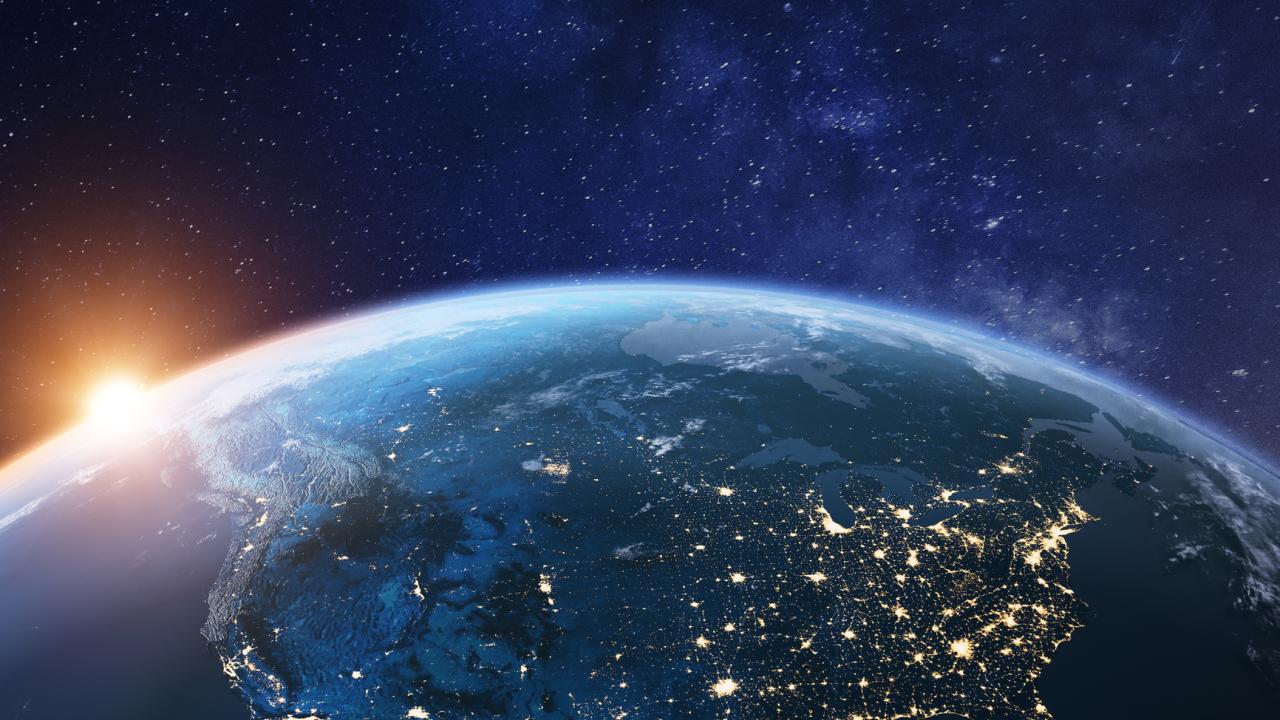 Earth seen from space, showing North America and city lights at night