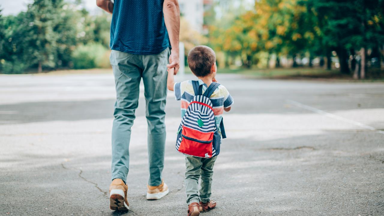 Child and adult walking