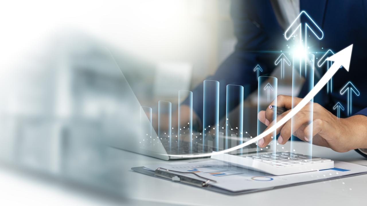 Illustration of buisness and finance data; man in blue jacket looking at data on digital platforms