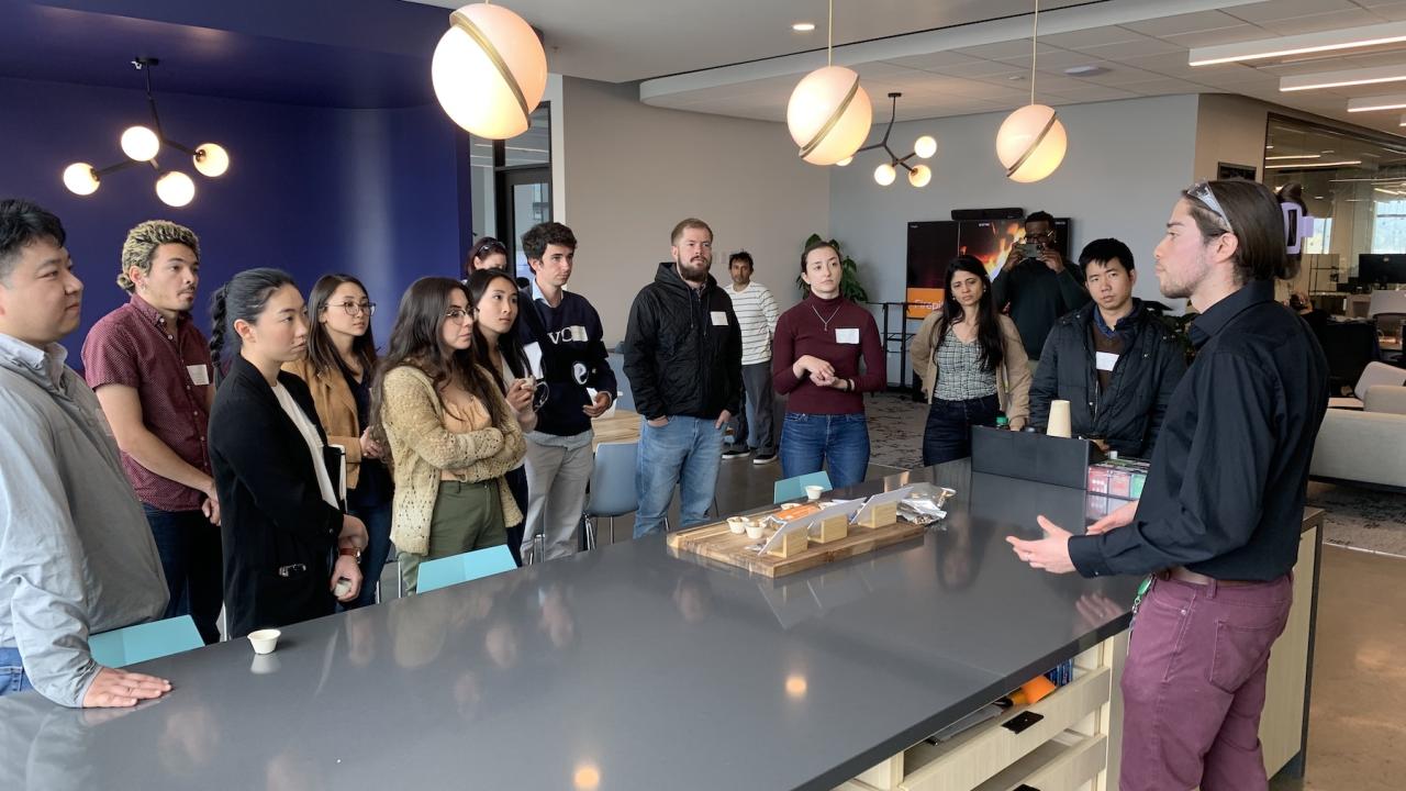 A dozen fellows from the UC Davis Innovation Institute For Food and Health listen to a speaker at an industry day event. (IIFH)