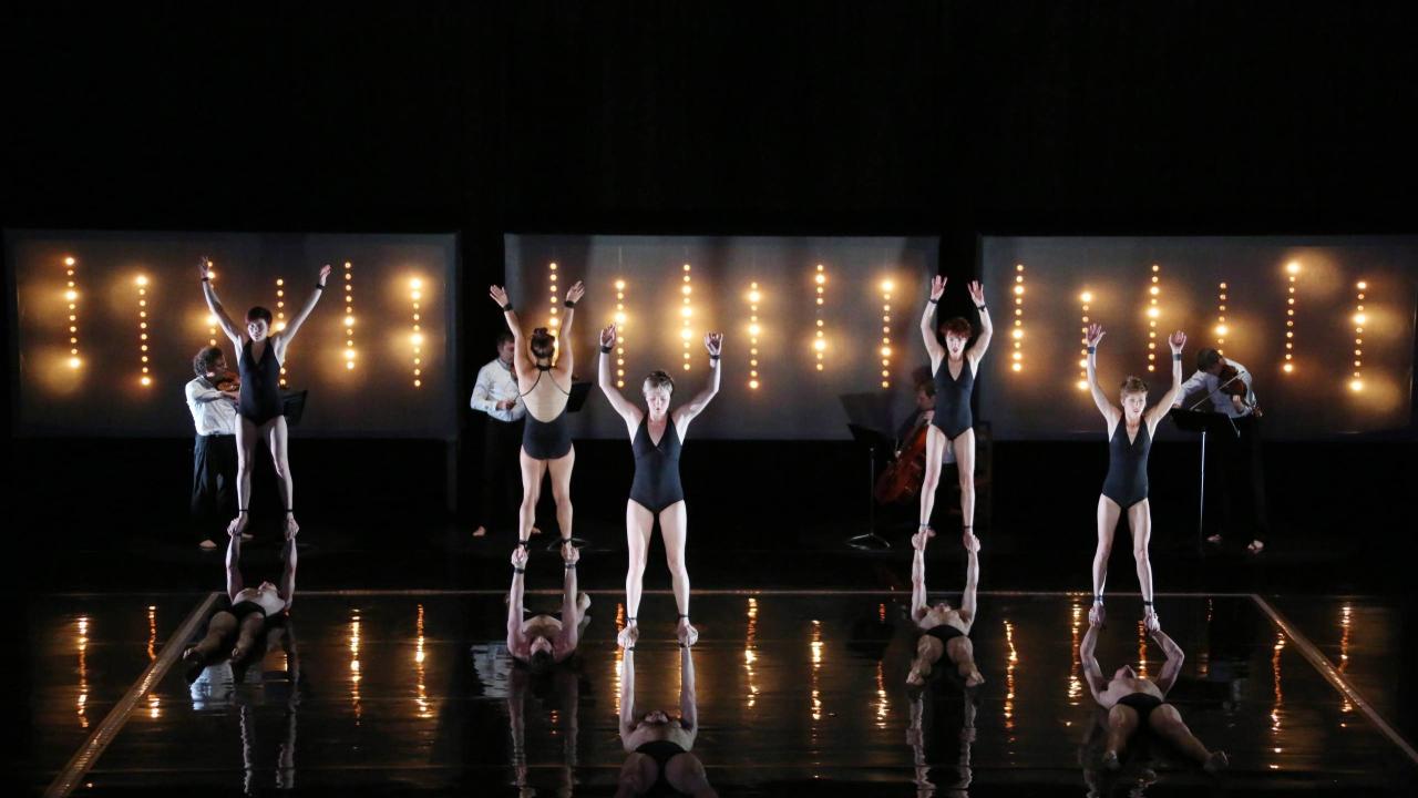 This weekend in Circa's "Opus", 10 acrobats and the Debussy String Quartet celebrate the music of Russian composer Dmitri Shostakovich in a work of stunning power, virtuosity and physical poetry (Justin Nicholas/ photography).