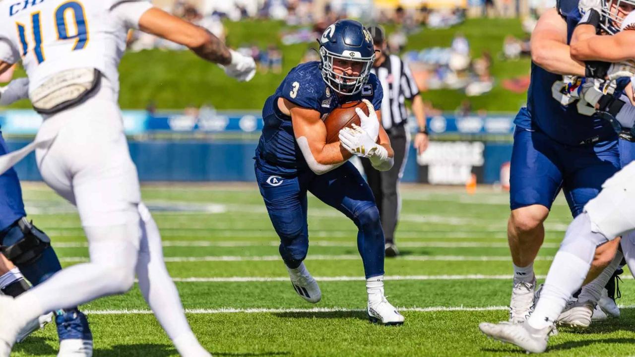 Lan Larison runs with the ball.