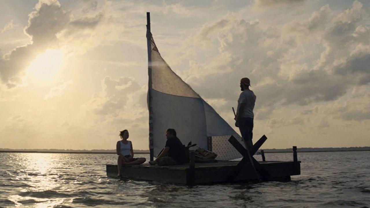 A raft on the water at sunset