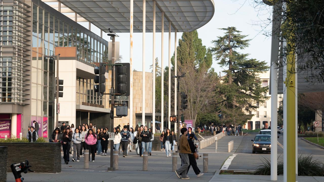 Students walk outside of the Mondavi Center at UC Davis