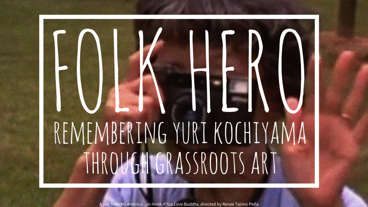 Exhibit shot of "Folk Hero", woman with hands up