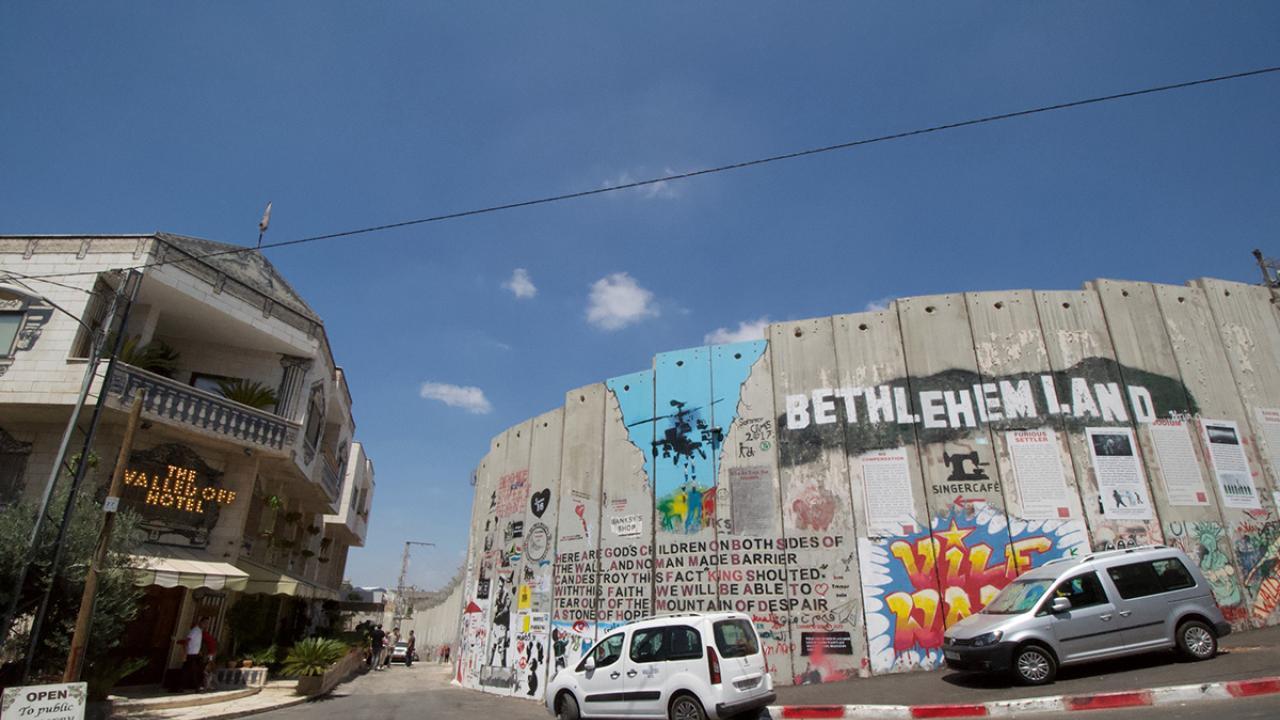 This year’s Templeton Colloquium, moderated by UC Davis professor of art and architectural history Heghnar Watenpaugh, features a powerful conversation on cultural heritage on Feb. 21. Join two of the most incisive voices in cultural heritage debates at the 2025 Templeton Colloquium to explore the stakes for its protection worldwide. Photo: The Walled Off Hotel in Bethlehem in August 2017. (Hrag Vartanian, Hyperallergic/ courtesy photo)