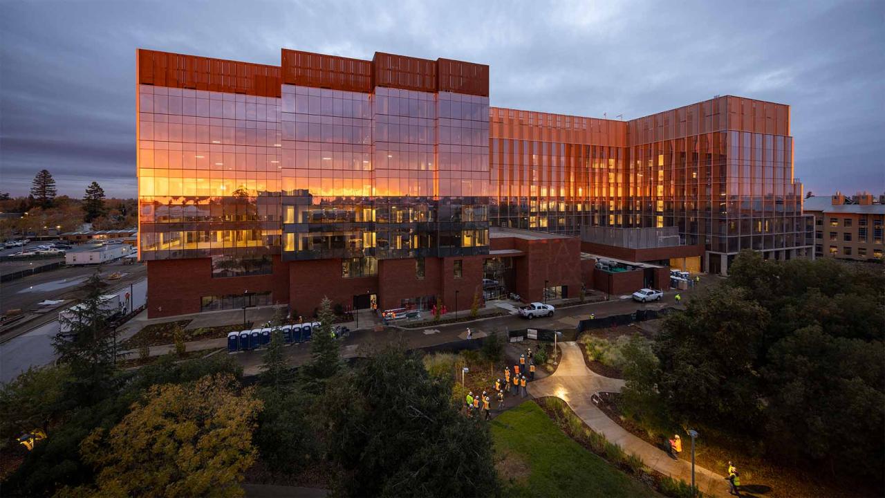 Light reflects on glass buildings at Aggie Square