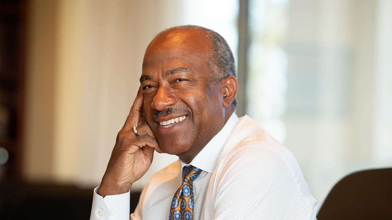 Chancellor Gary May smiling for a picture