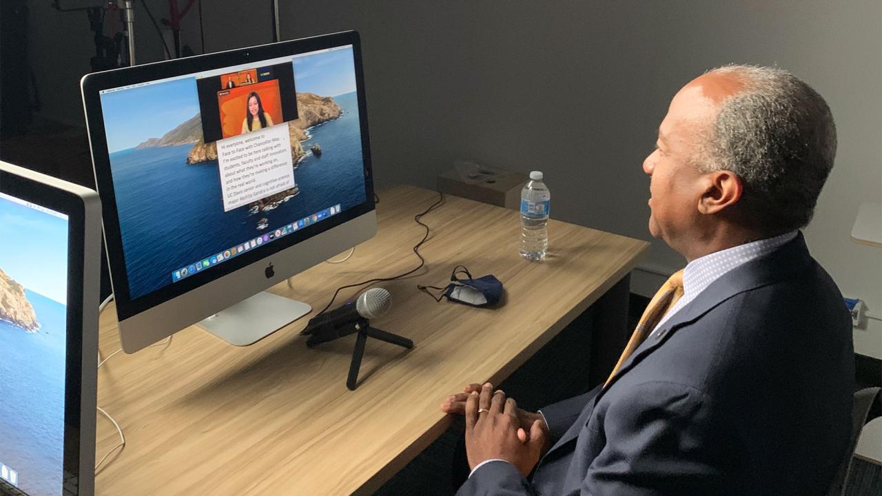 Chancellor Gary S. May interviews student via video chat.