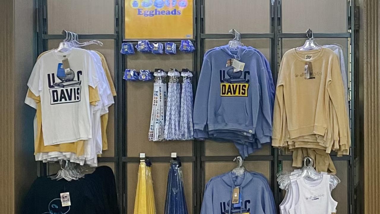An in-store display of clothing and accessories available at UC Davis Stores both online and in person.