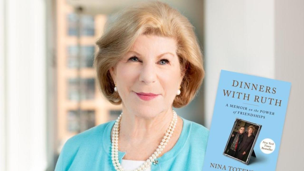Photo of woman in blue dress holding book