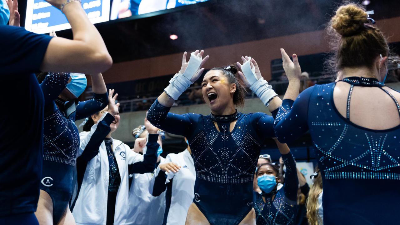 Gymnast celebrates after routine