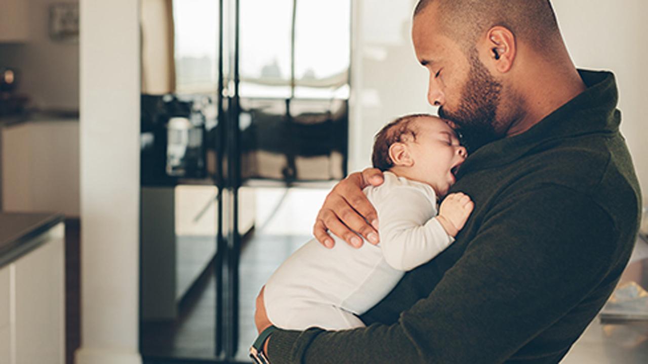 Man holding a baby.