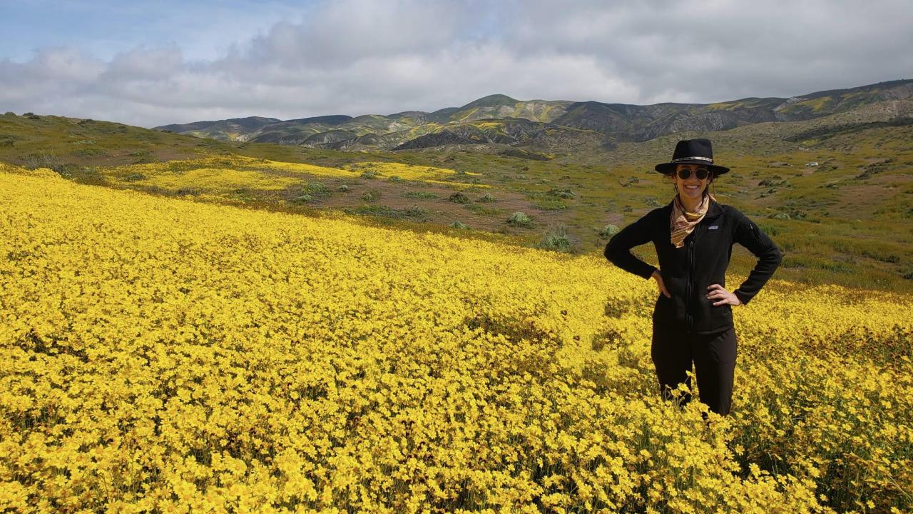 Marina LaForgia posing in a field of flowers