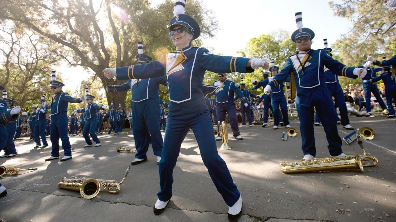 Members of the UC Davis Marching Band dance and perform during the Picnic Day parade.