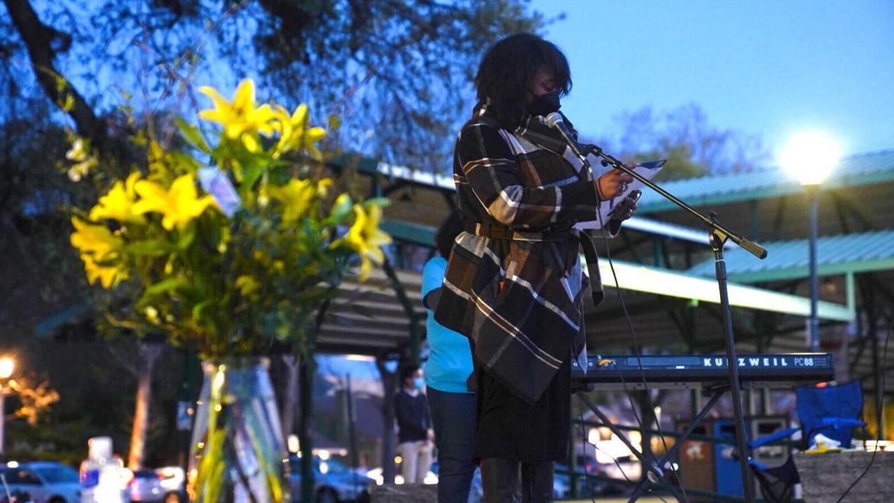 Renetta Garrison Tull speaks at vigil.