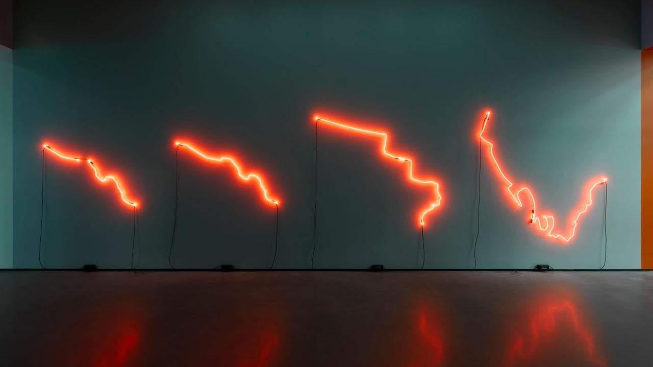 Neon sign with orange on black background