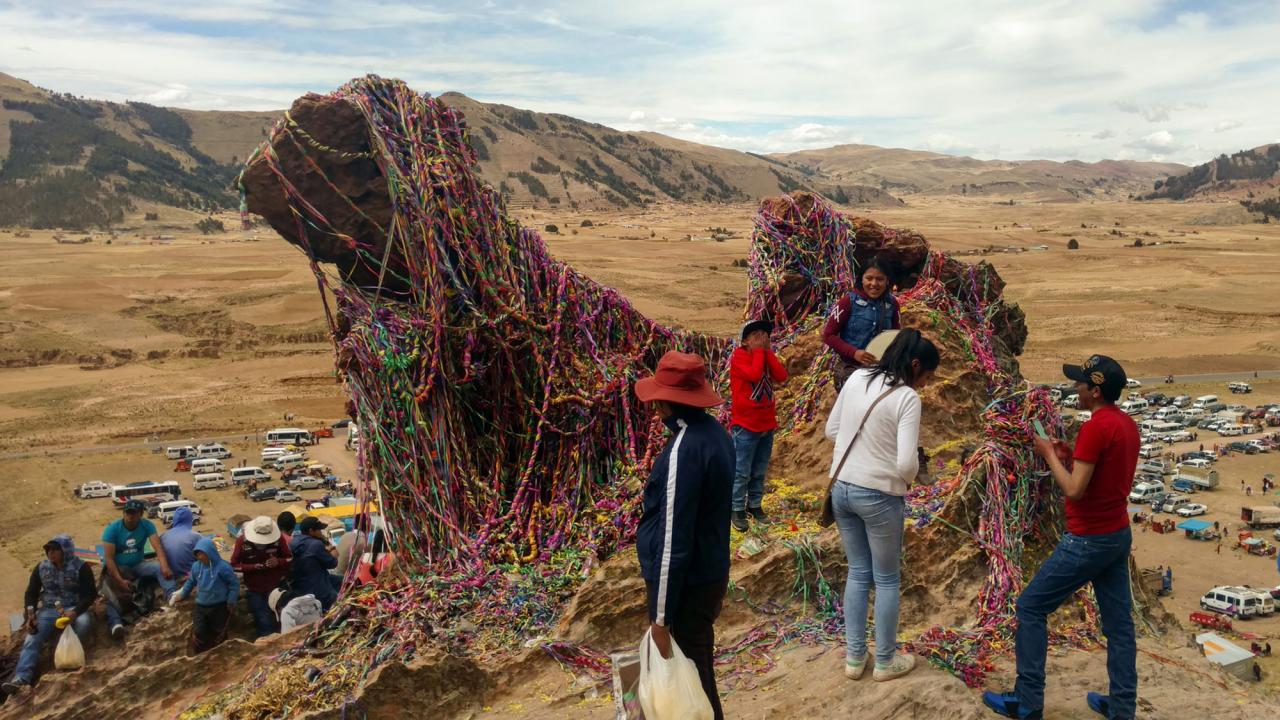Site of a pilgrimage in Peru with people gathered around relics