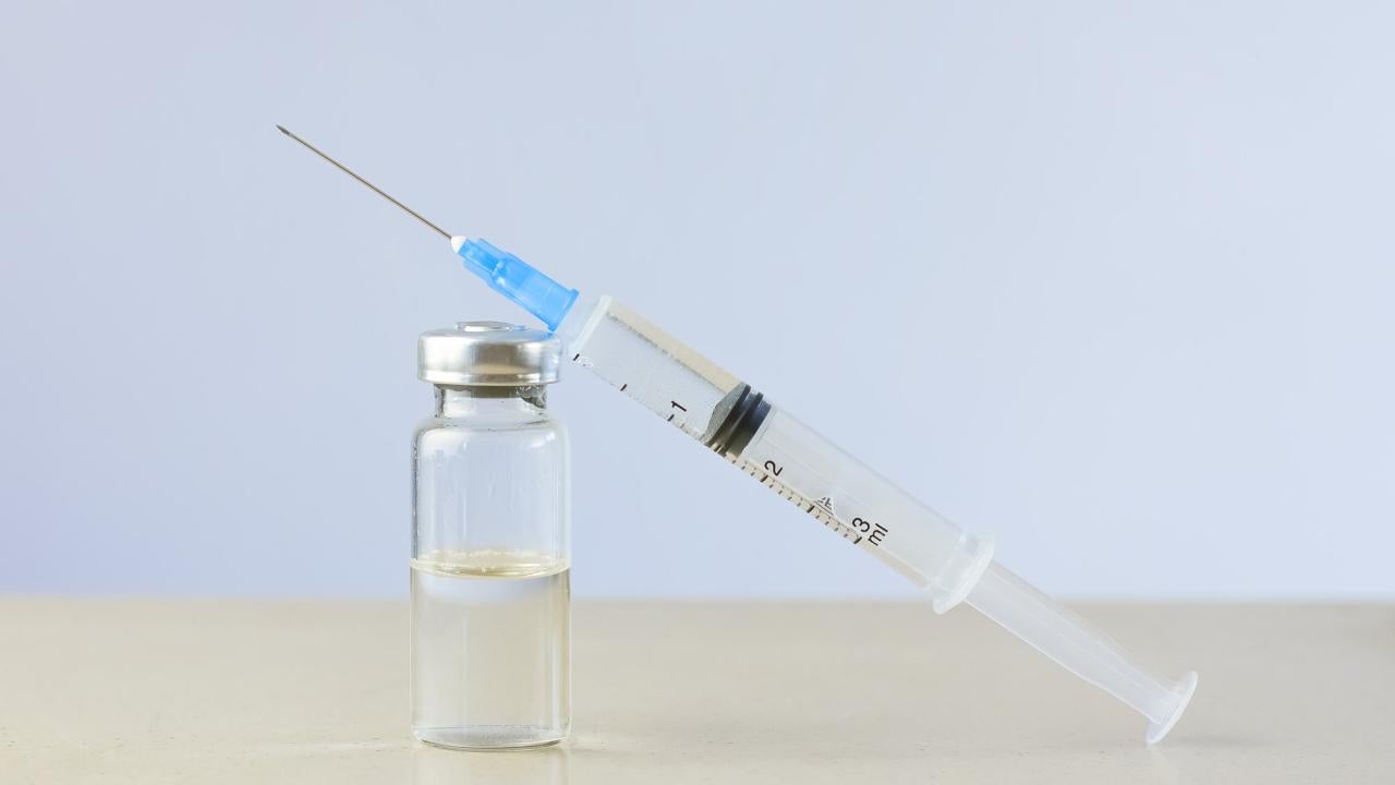Syringe and vial of vaccine